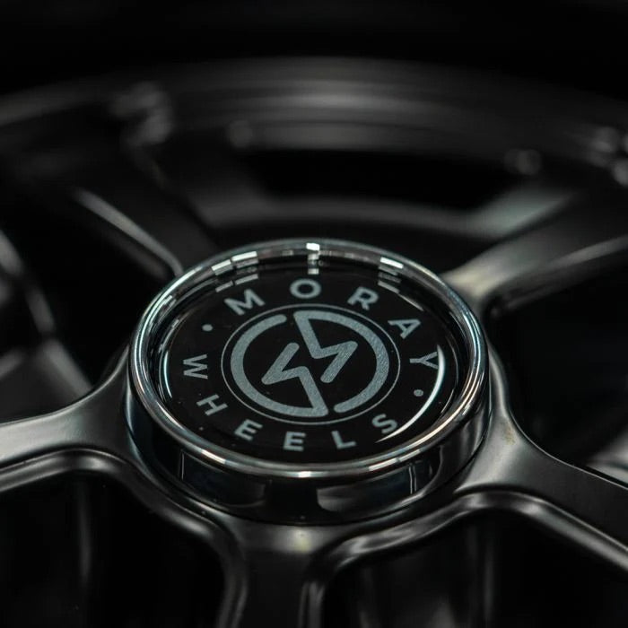 Closeup of the center cap with the Moray Wheels logo